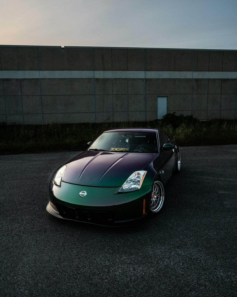 black porsche 911 parked on road near building during daytime