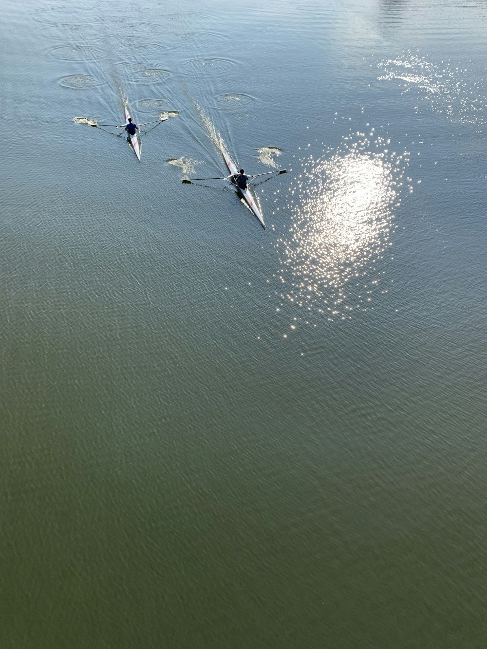 2 person surfing on sea during daytime