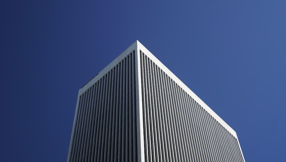 white and black concrete building under blue sky during daytime