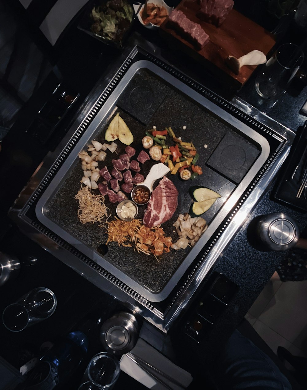 cooked meat on black plastic container