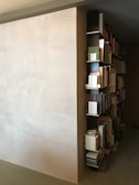 Minimalist bookshelf filled with books and decor.