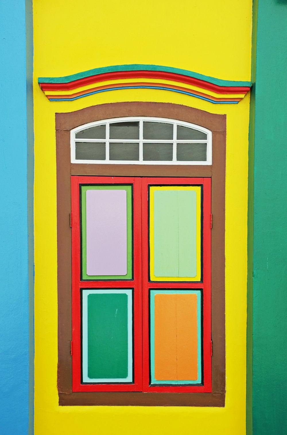 red blue and yellow wooden window