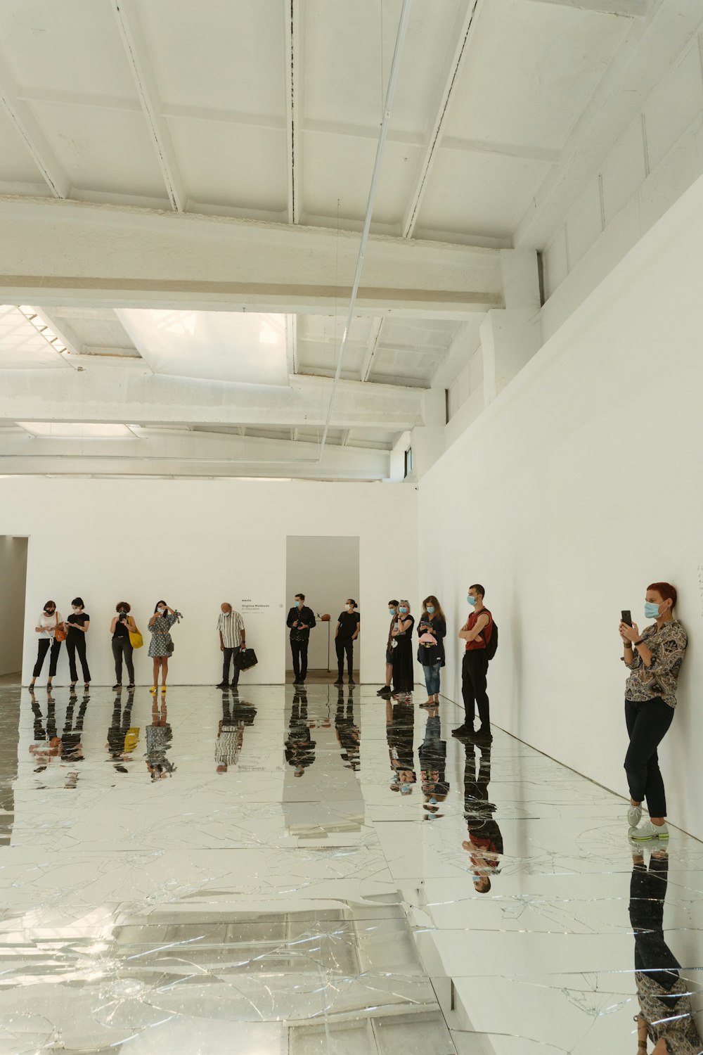 people standing on white floor tiles