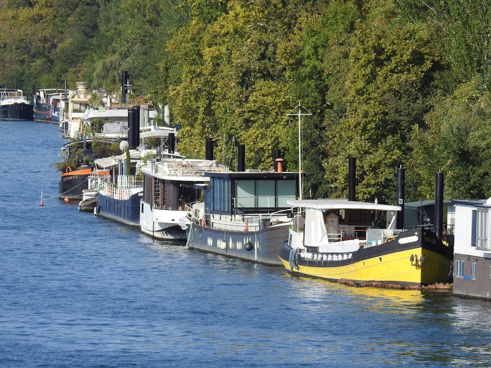 yellow and white boat on body of water during daytime