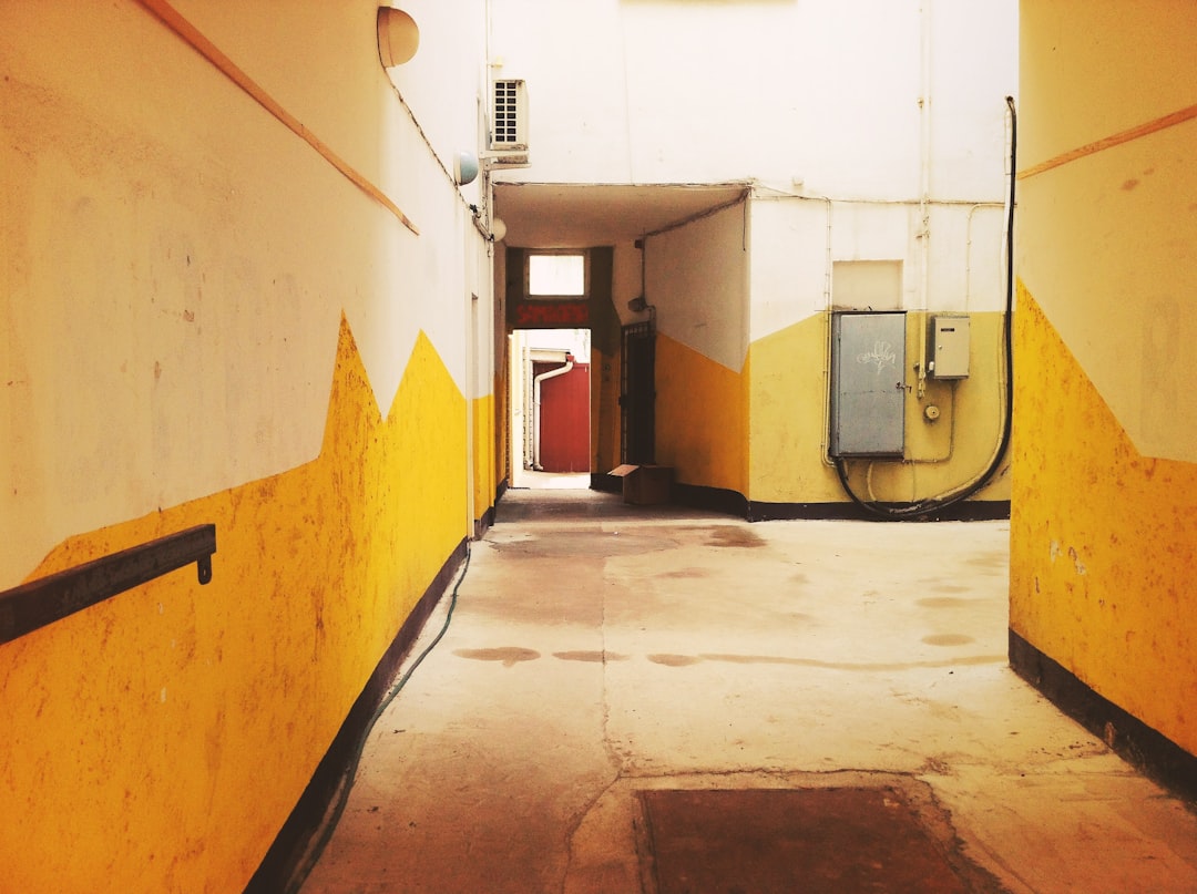 white and brown hallway with white wall,