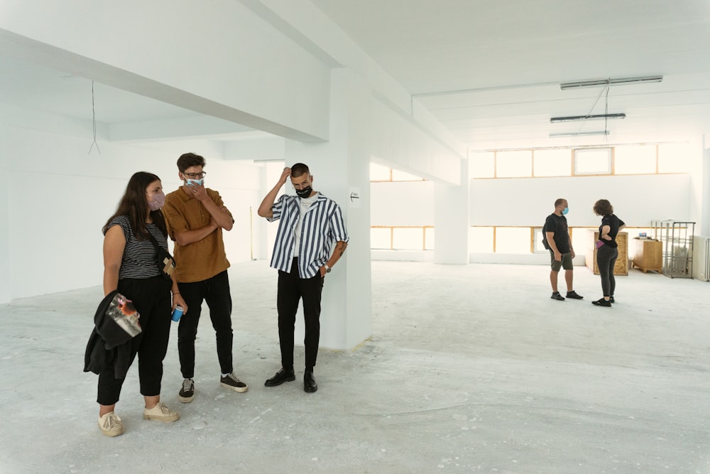 people standing on white floor