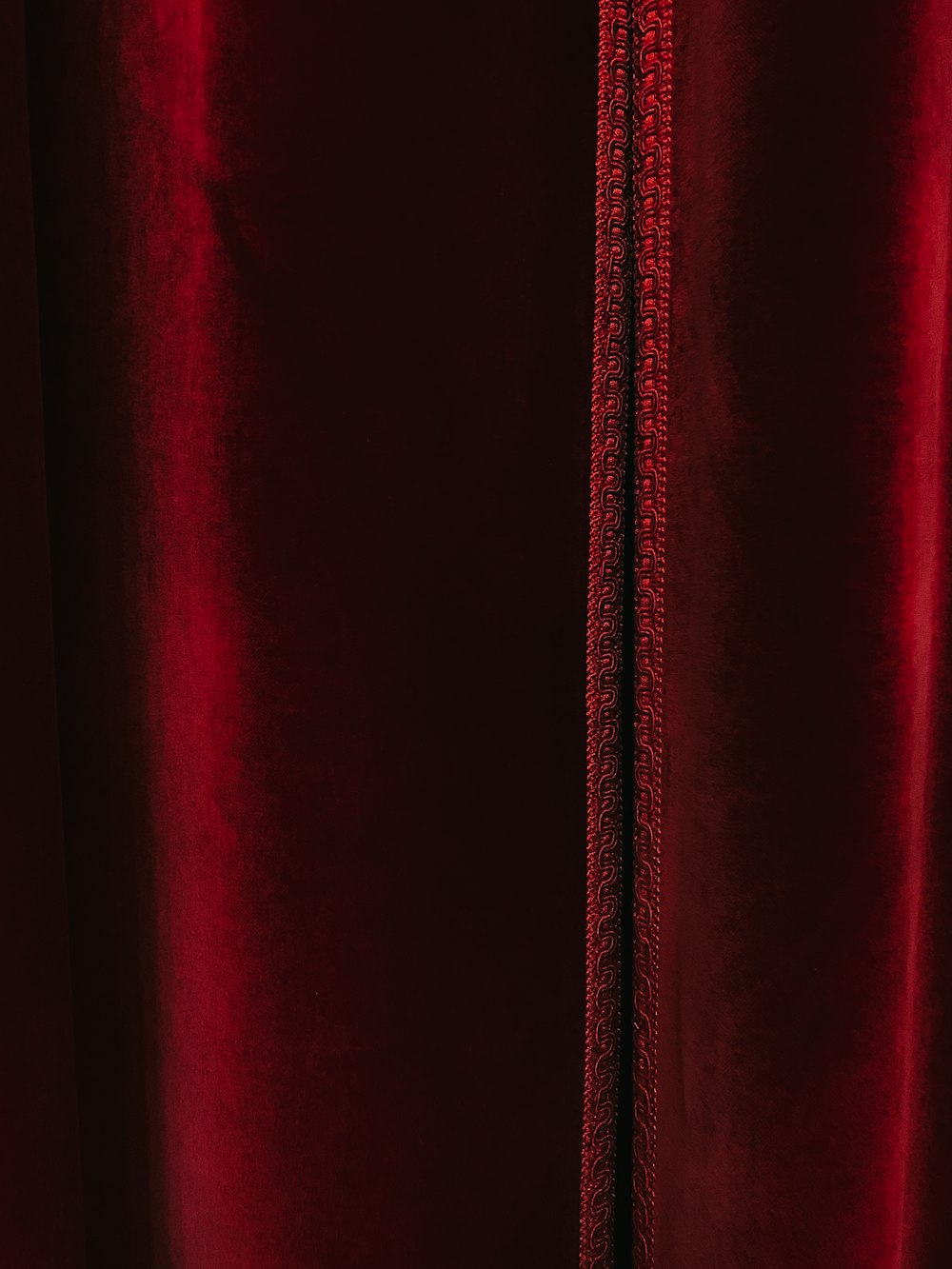 red textile in close up photography