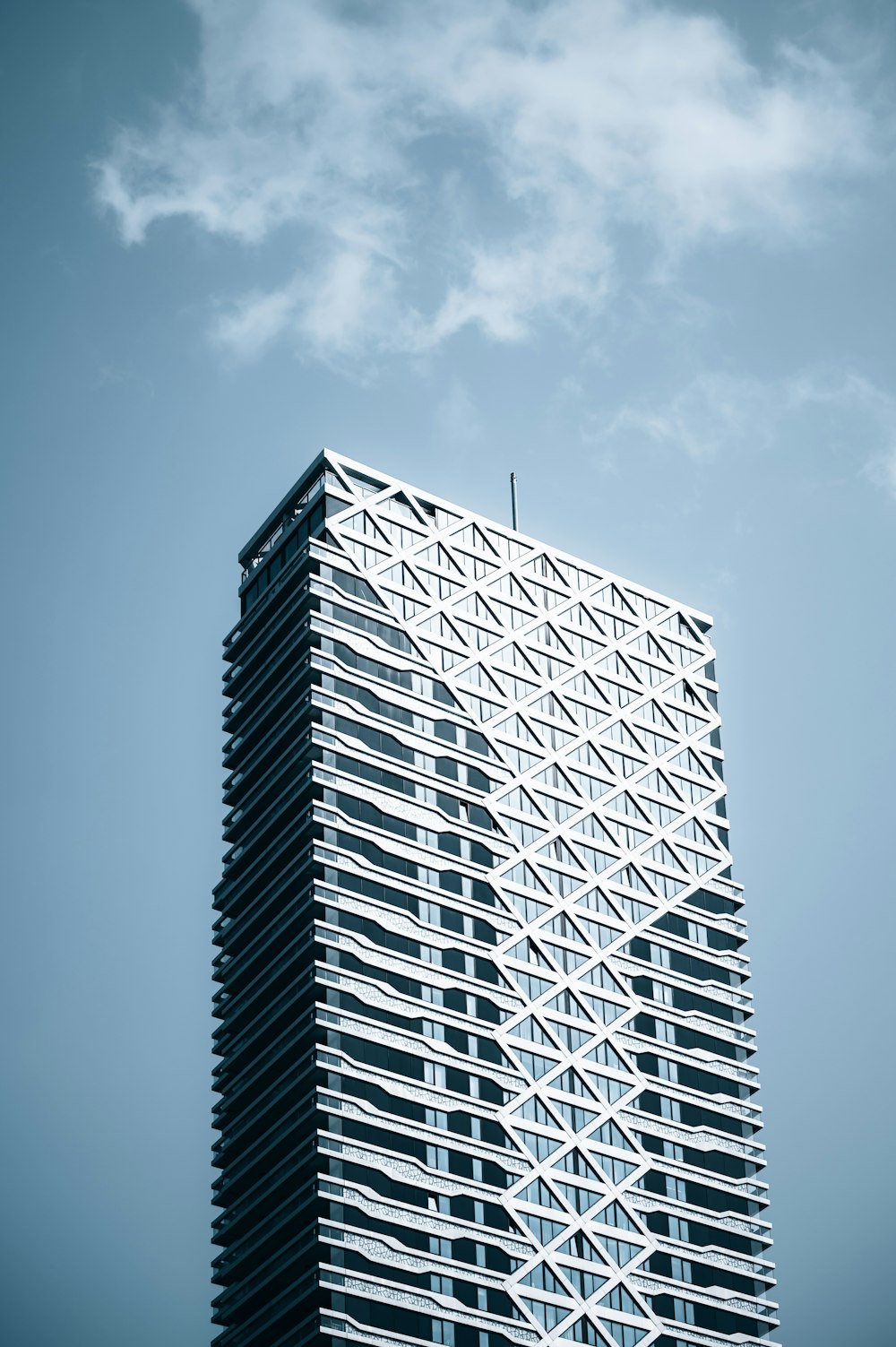 white and black building under blue sky during daytime