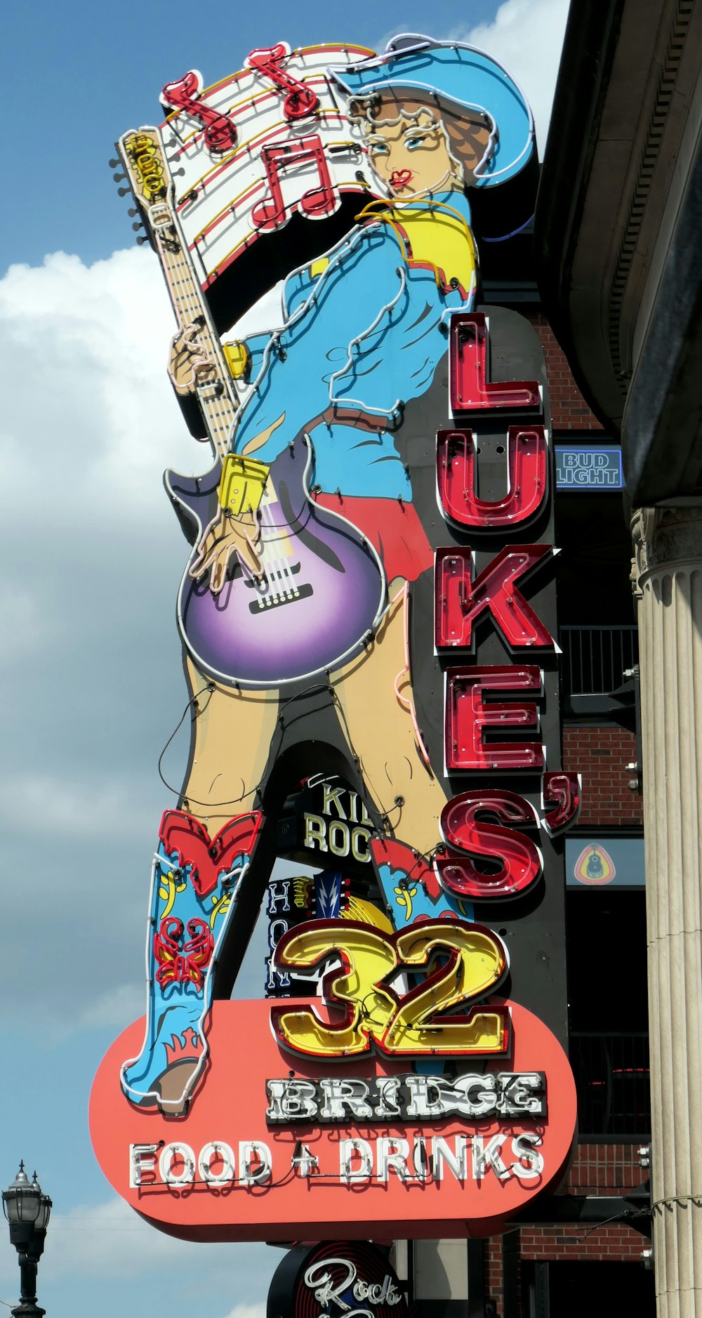 a large neon sign on the side of a building