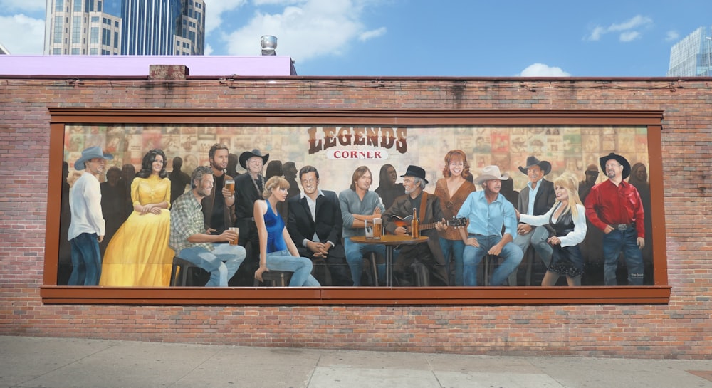 group of people standing in front of brown wooden table during daytime