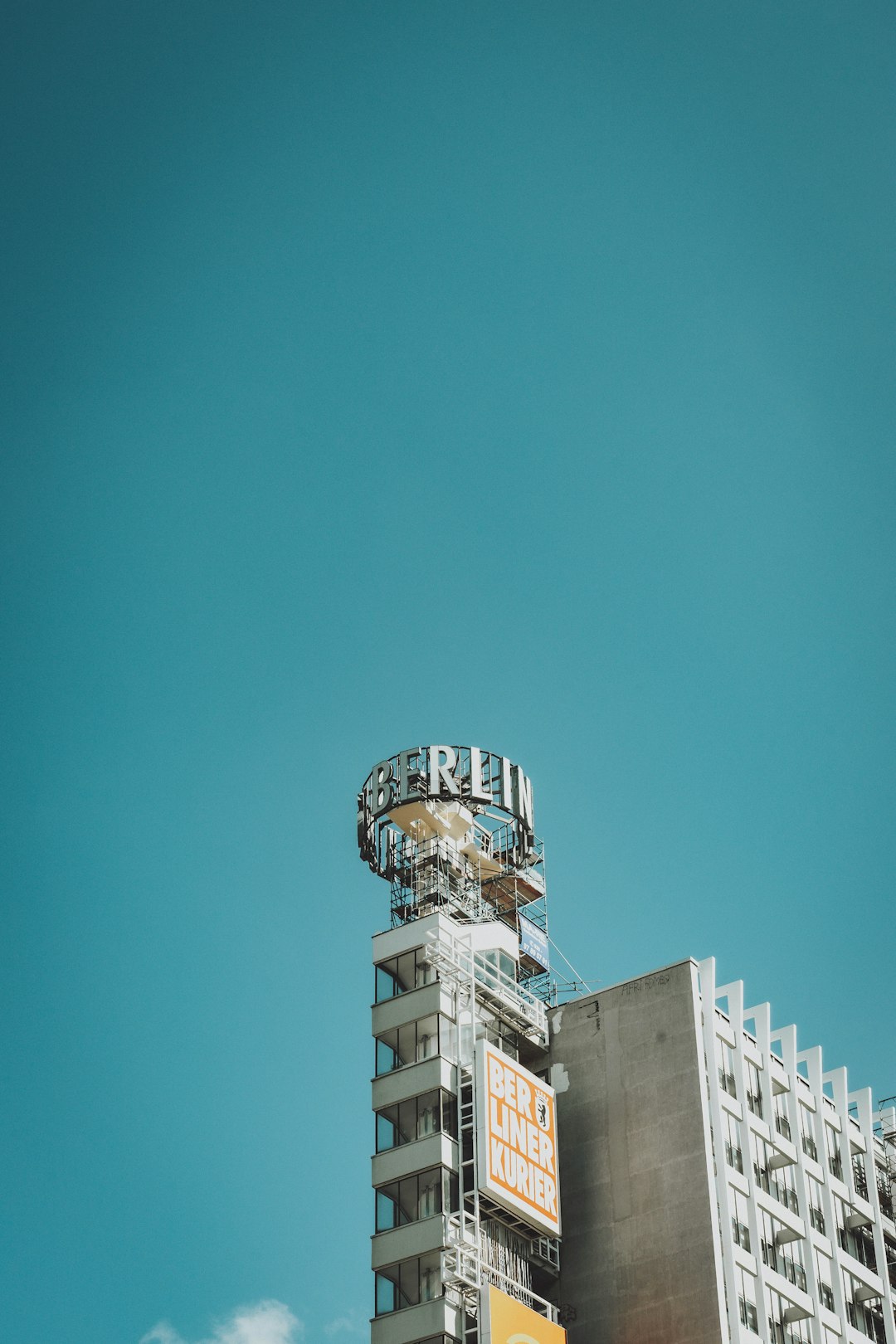 white and blue concrete building under blue sky during daytime