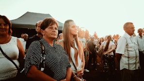 A lively group of couples enjoying a sunset cocktail hour at an outdoor interracialcuckoldapps.com gathering