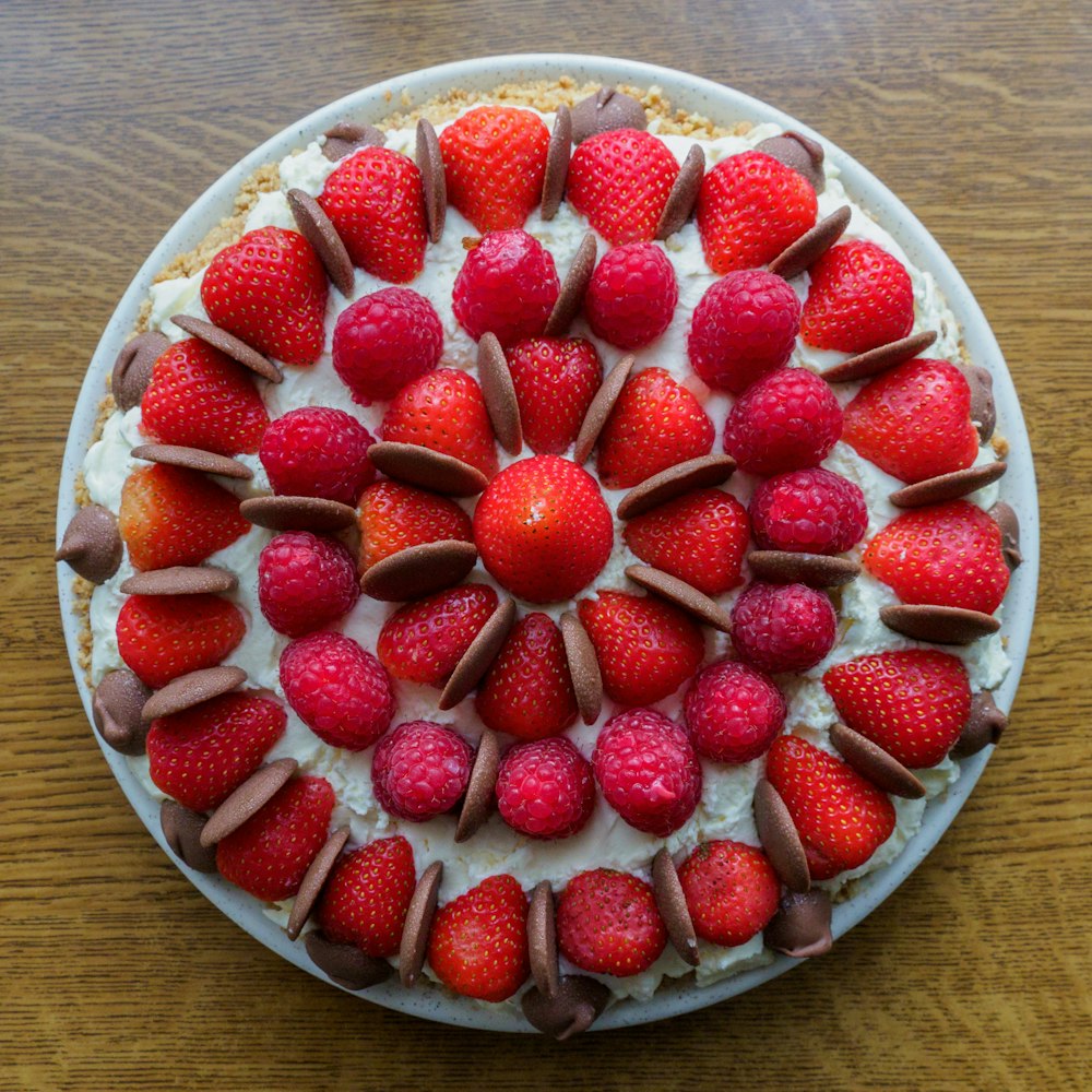 strawberries on clear glass bowl