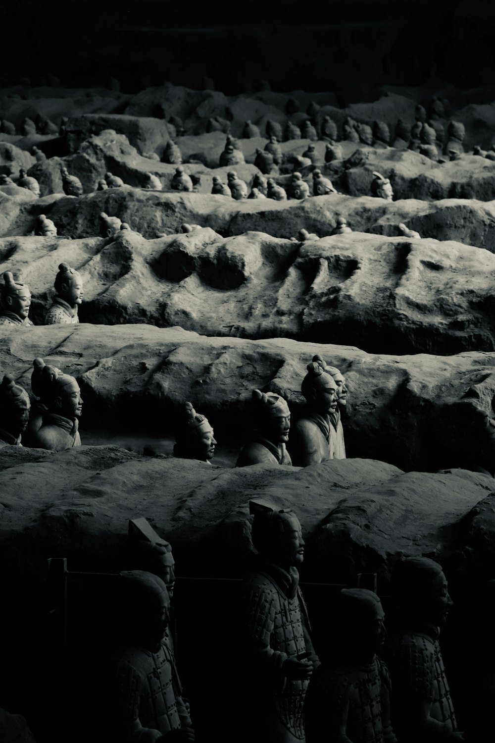 group of penguins on rock formation