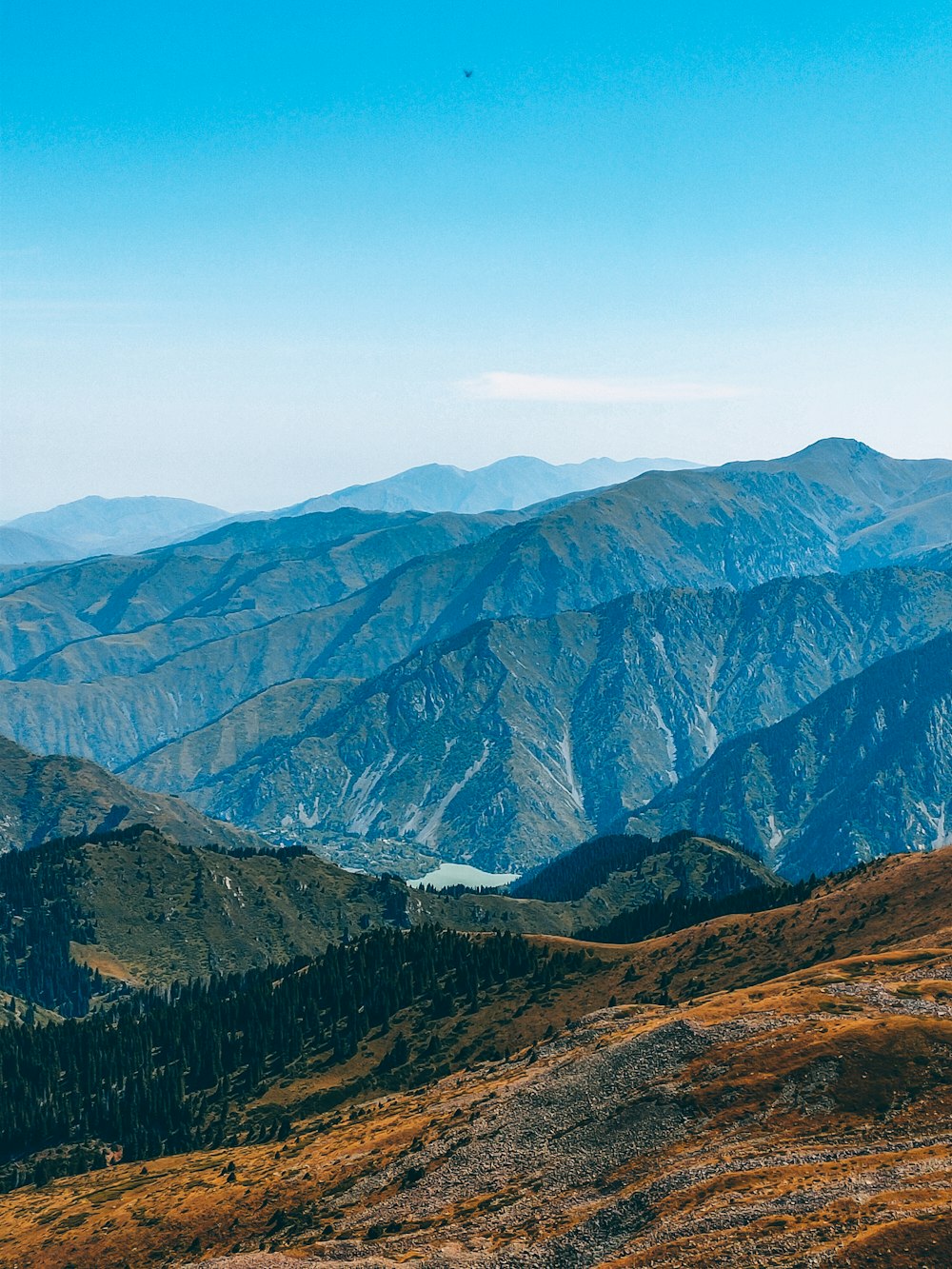 brown and green mountains under blue sky during daytime