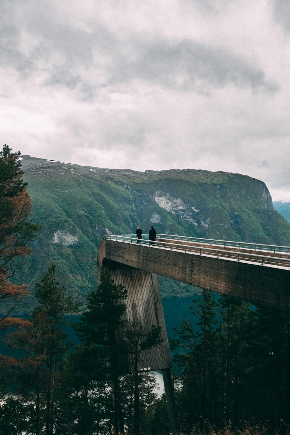 gray concrete bridge over river