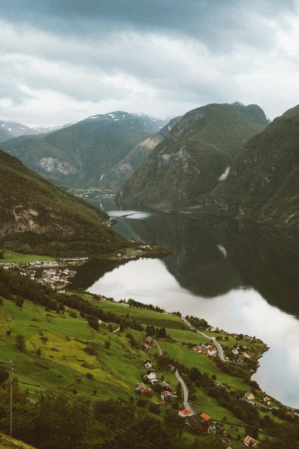 green mountains near lake during daytime