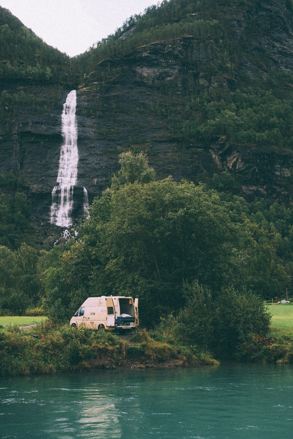 white and brown house near waterfalls