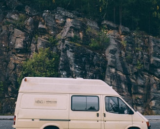 white van parked near mountain