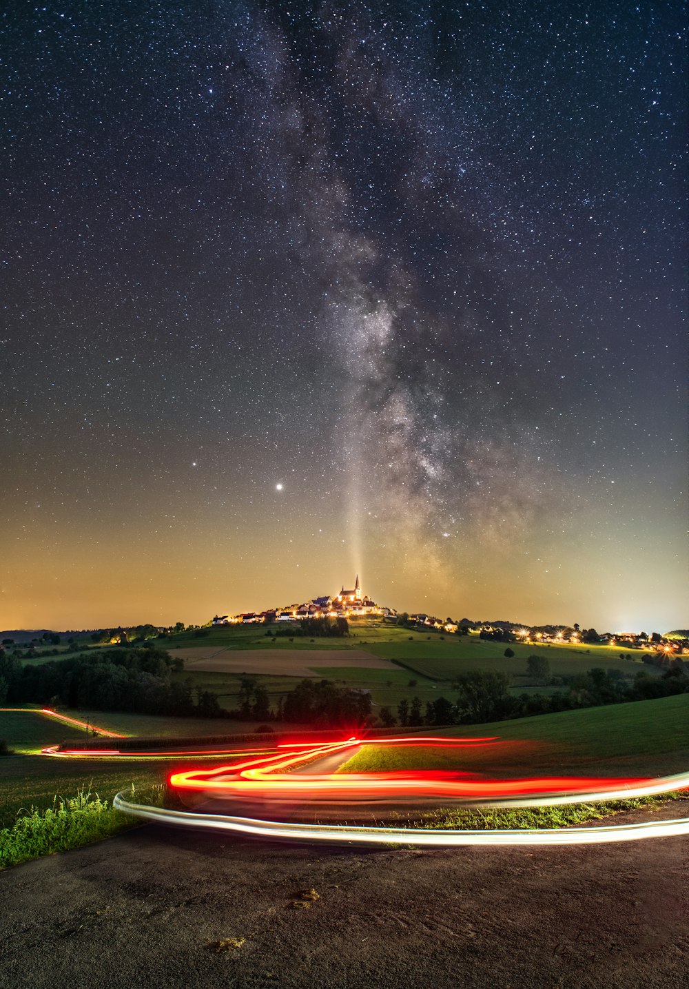 green grass field under starry night