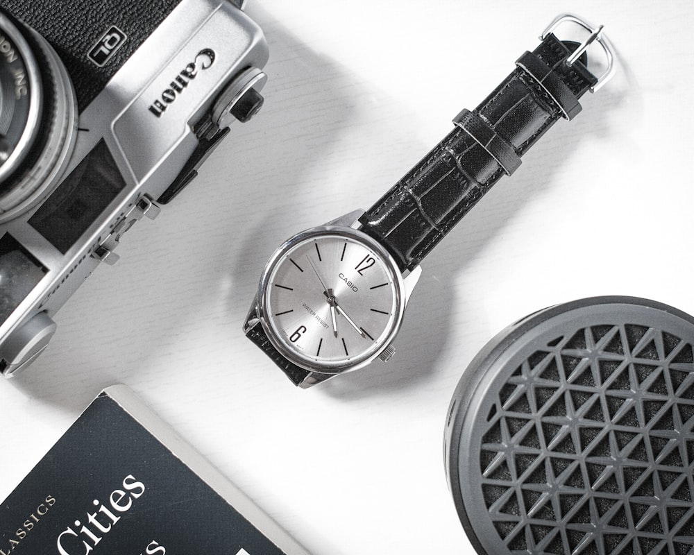 black strap silver round analog watch