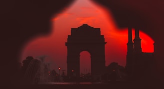silhouette of a building during sunset