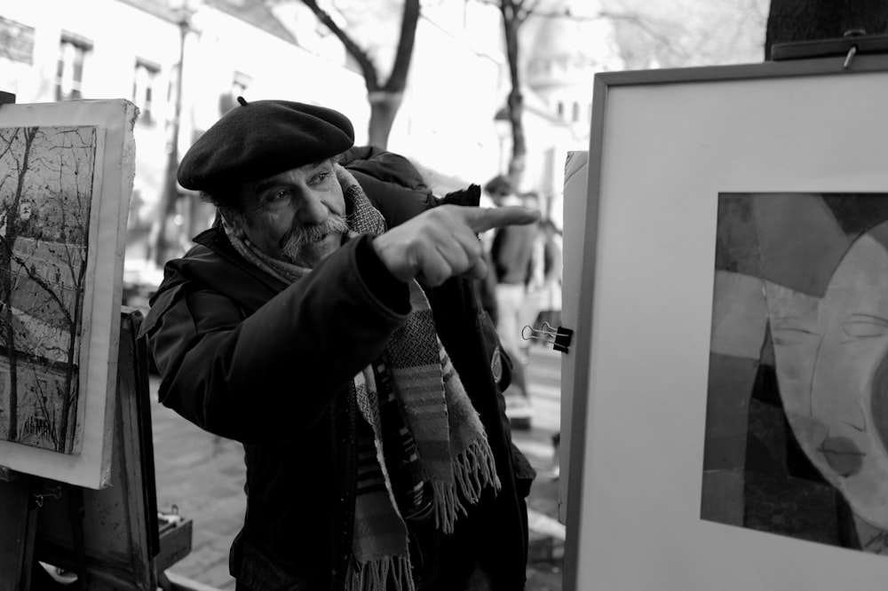 man in black jacket and hat