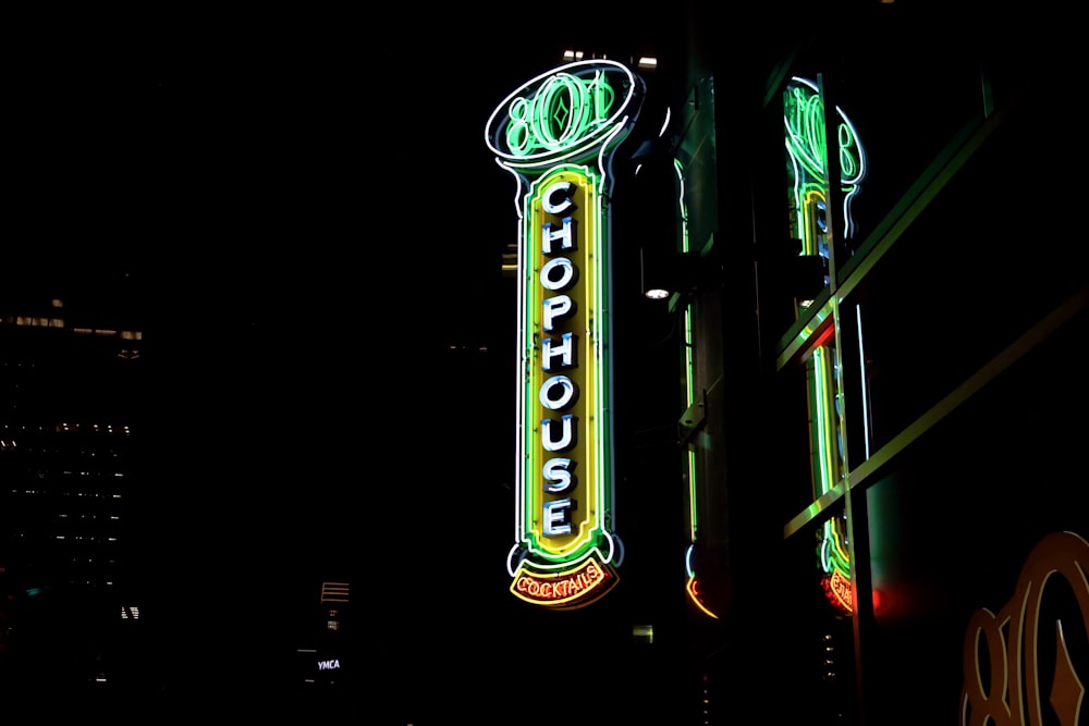 a neon sign on the side of a building