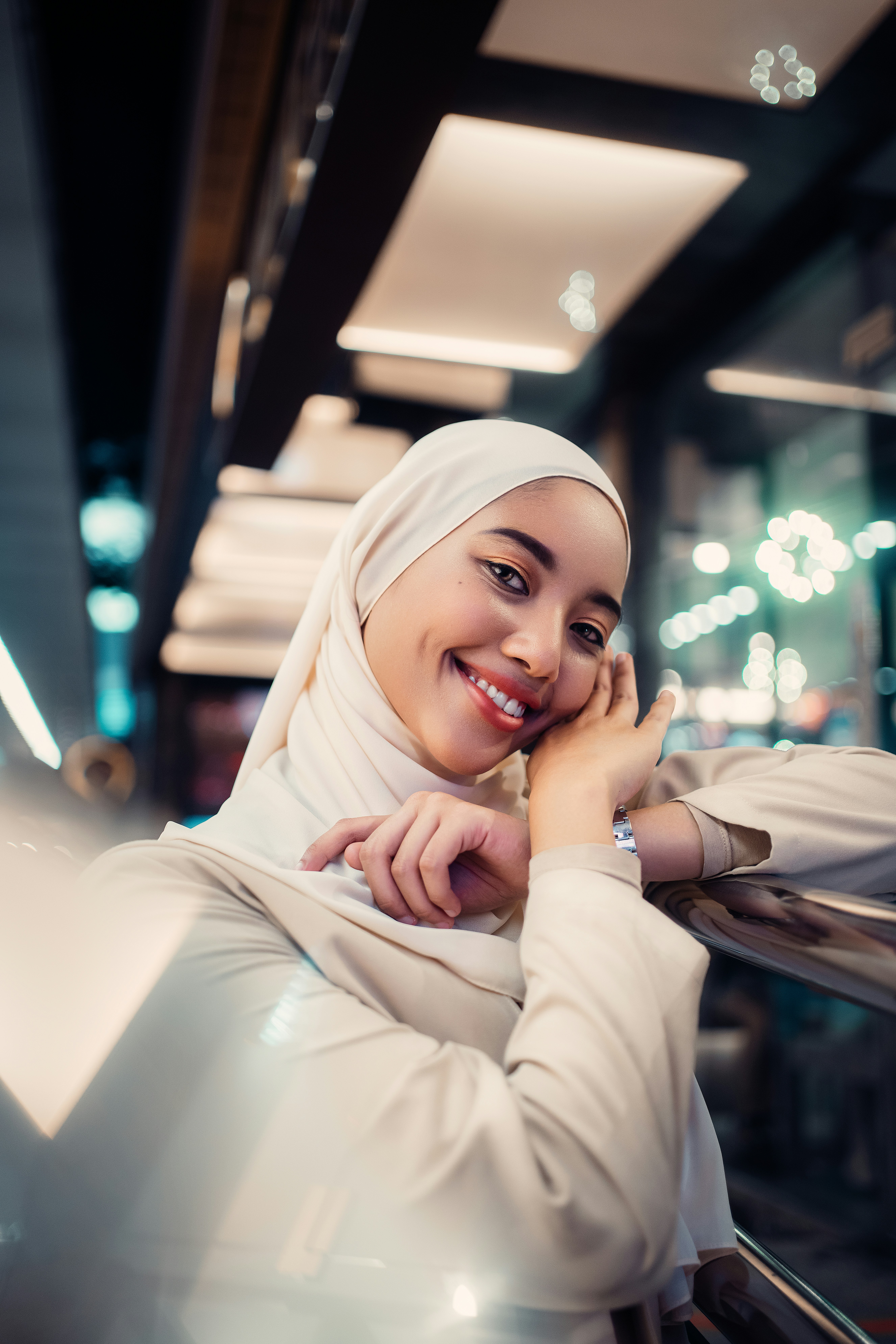 woman in white hijab sitting on white chair