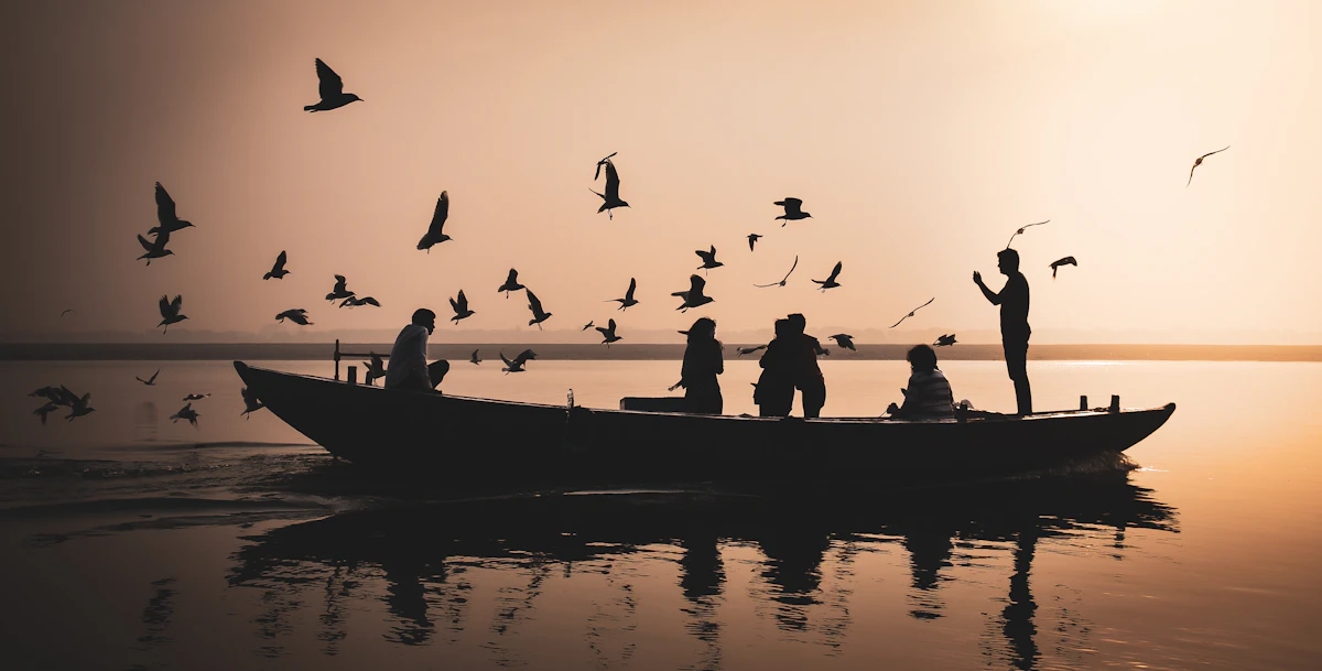 Boats on the Ganges at sunrise near the ancient ghats of Varanasi