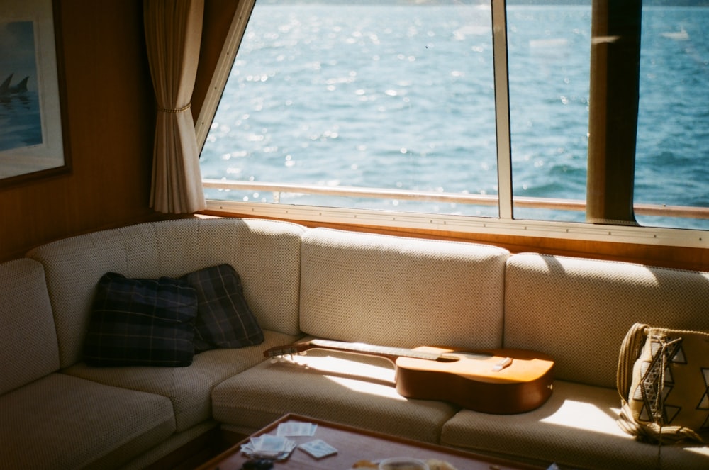 brown and black sofa near window