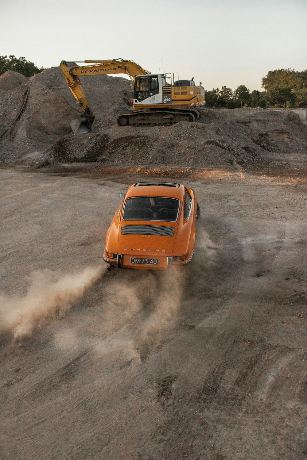 orange and black car on brown soil