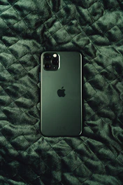 black iphone 7 plus on black and white textile