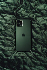 black iphone 7 plus on black and white textile