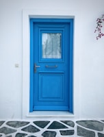 An electric blue door with a lightning bolt symbol for the switchup teen stage, radiating a subtle neon glow in the digital hallway
