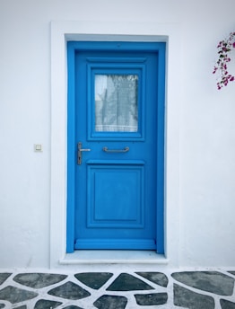 An electric blue door with a lightning bolt symbol for the switchup teen stage, radiating a subtle neon glow in the digital hallway