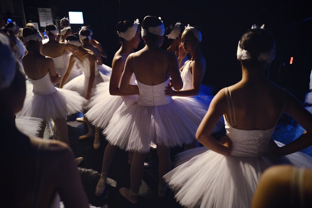 woman in white dress dancing on stage