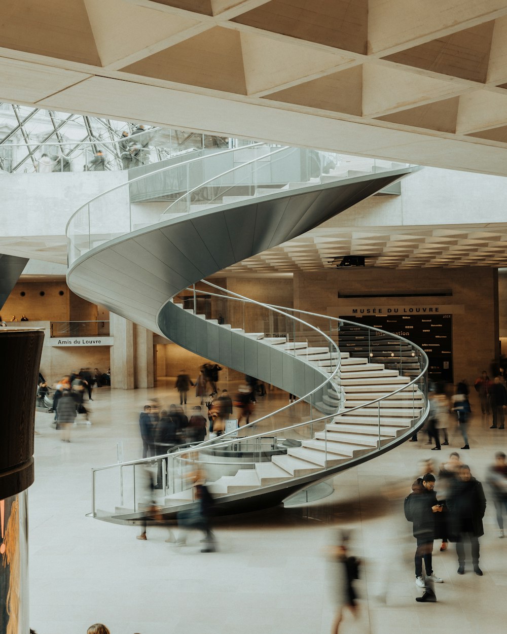 people walking on spiral staircase