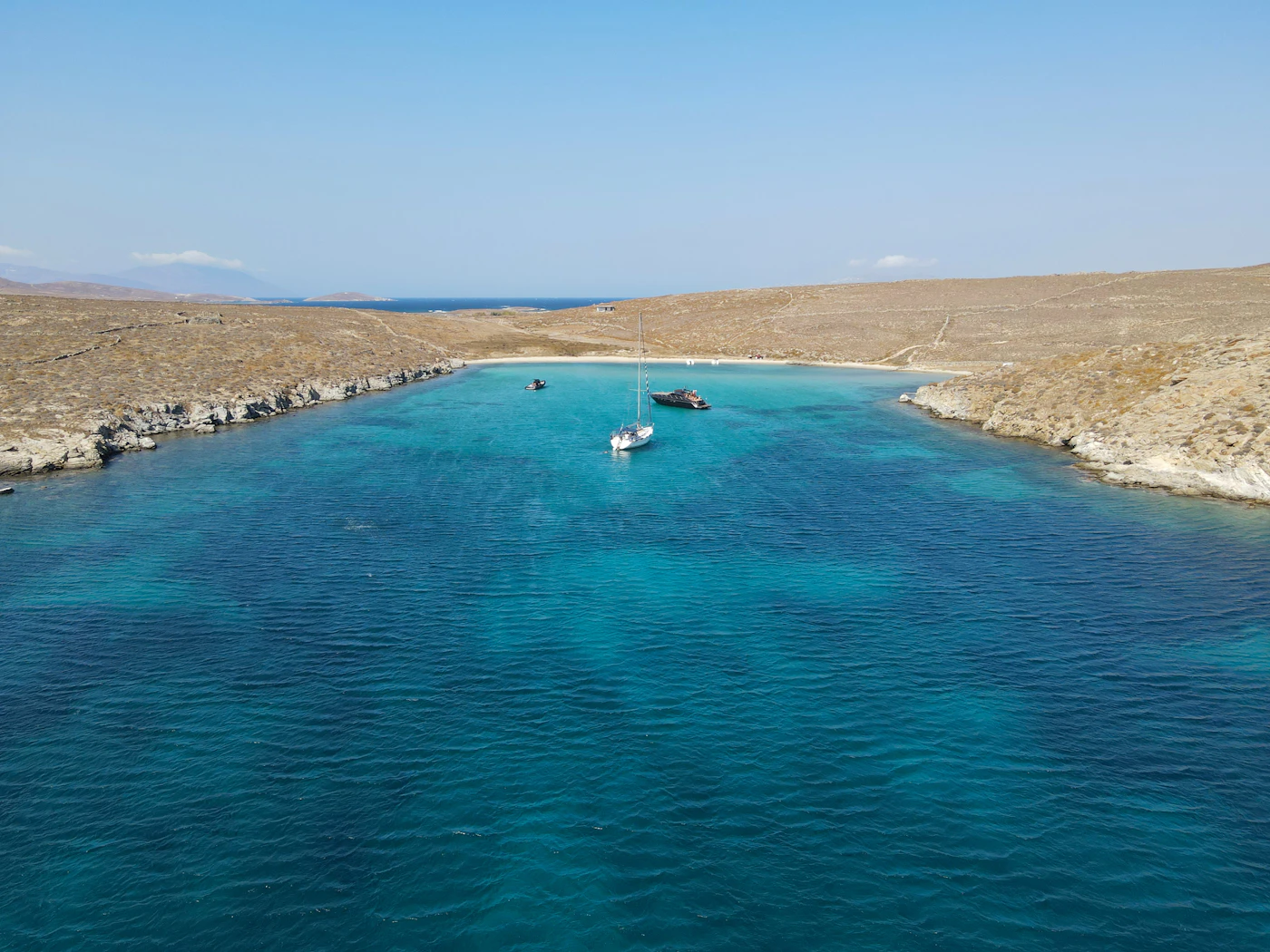 Clear blue water and coastline near Mykonos, Greece