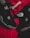 Black athletic shoes are placed alongside red and black sportswear bearing logos from Spalding and The North Face.