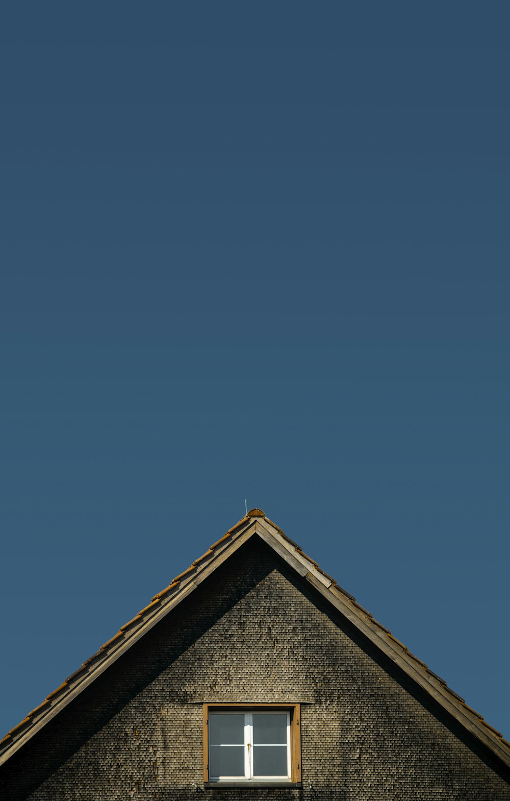 brown and gray house under blue sky during daytime