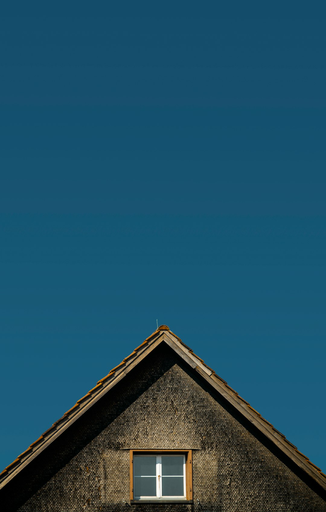 brown and gray house under blue sky during daytime