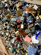 Various padlocks hanging on a display rack in a busy hardware store