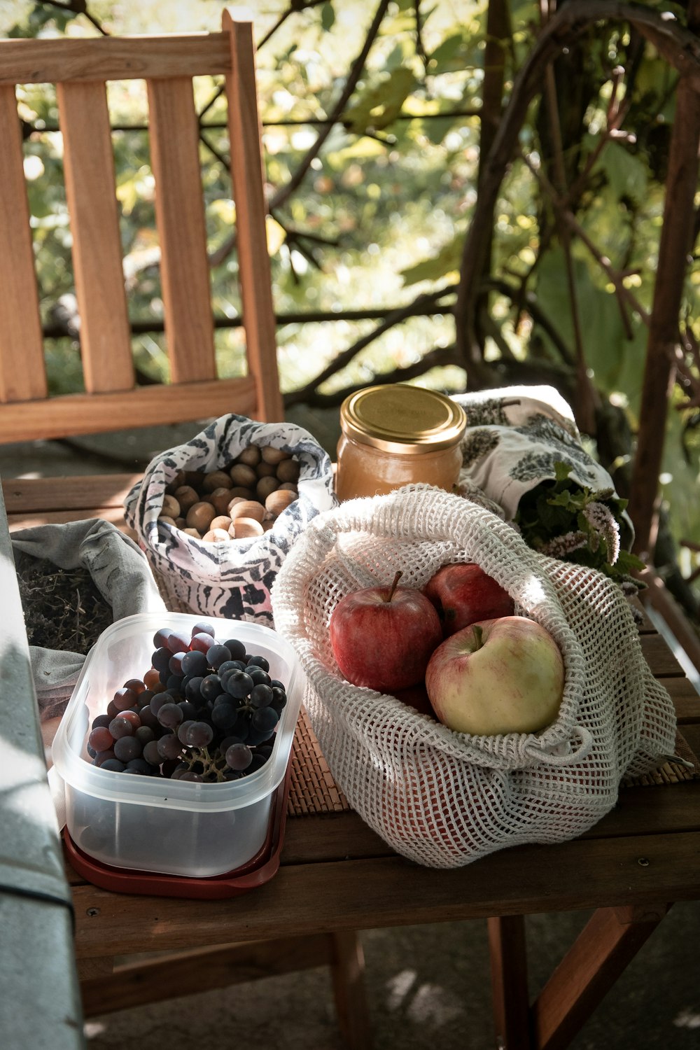 red apples on white woven basket