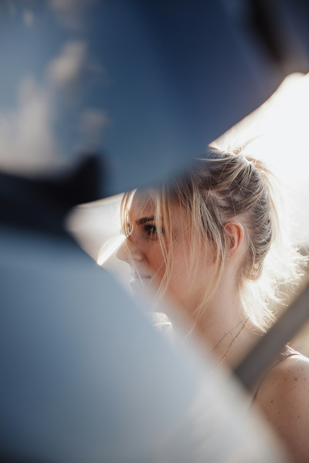 woman in white shirt wearing eyeglasses