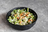 vegetable salad in black bowl