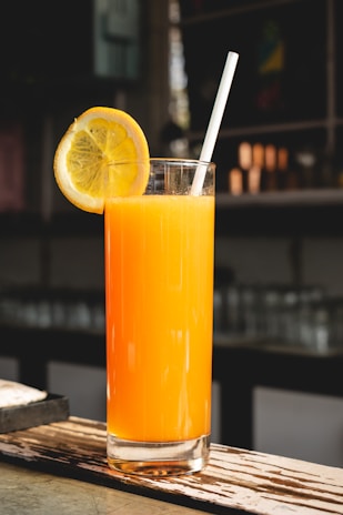 A café barista preparing a fresh citrus drink using Miracle Orange Indonesia’s produce.