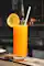 Bottle and glass of orange juice