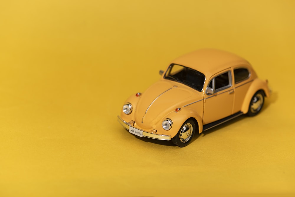 yellow volkswagen beetle scale model