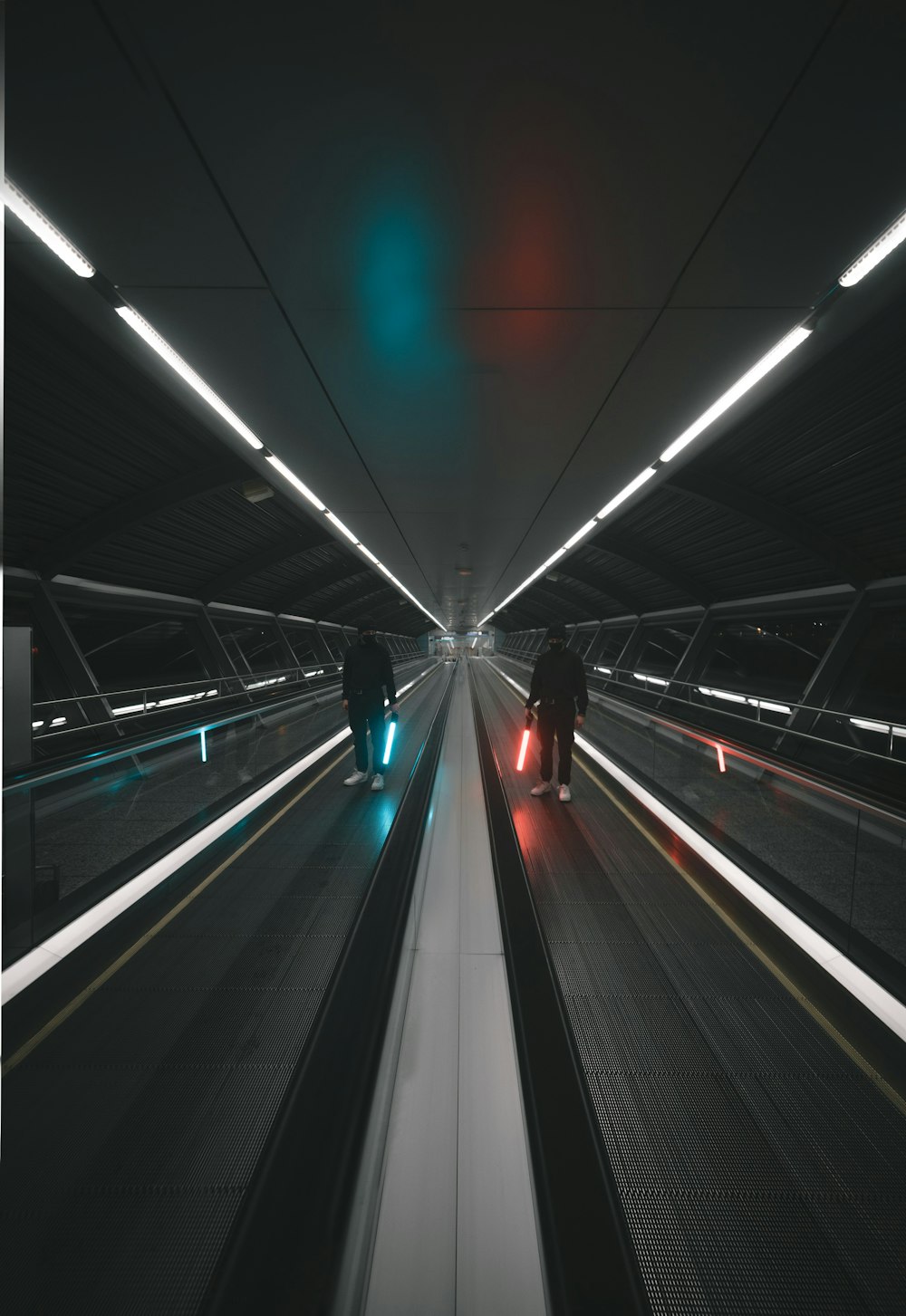 people walking on a tunnel